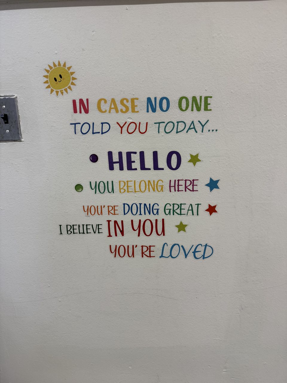 Classroom wall reading In case no one told you today, you belong here, you are loved