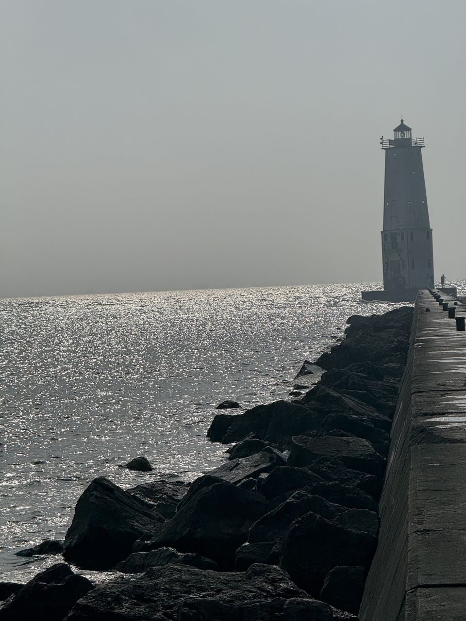 The Frankfort lighthouse on the pier at dusk